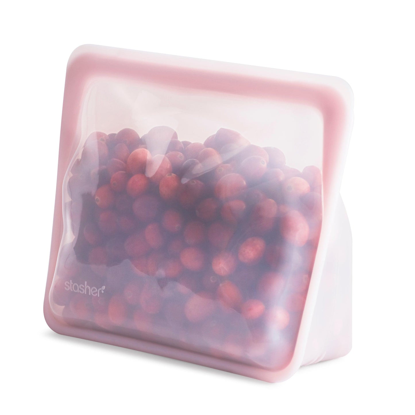 Bolsa de silicona platino mediana con base rosa llena de arándanos de Stasher - LLevar & LLevar